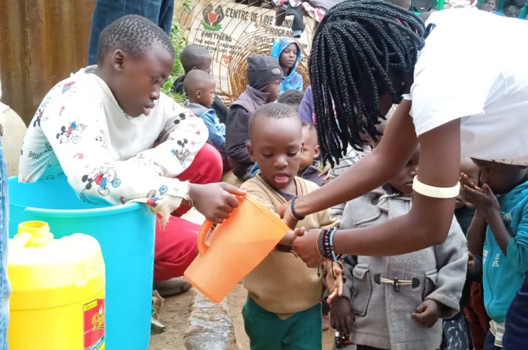 Children collecting clean water at the Centre